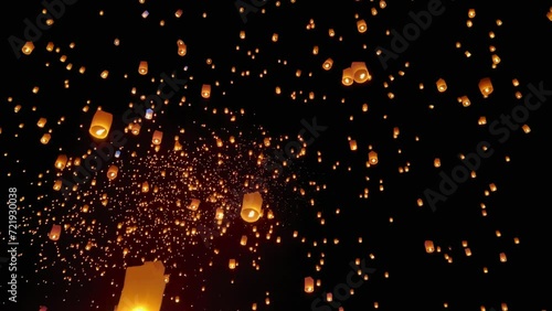 Flying lanterns in night sky in Loy Krathong festival, Chiangmai, Thailand
