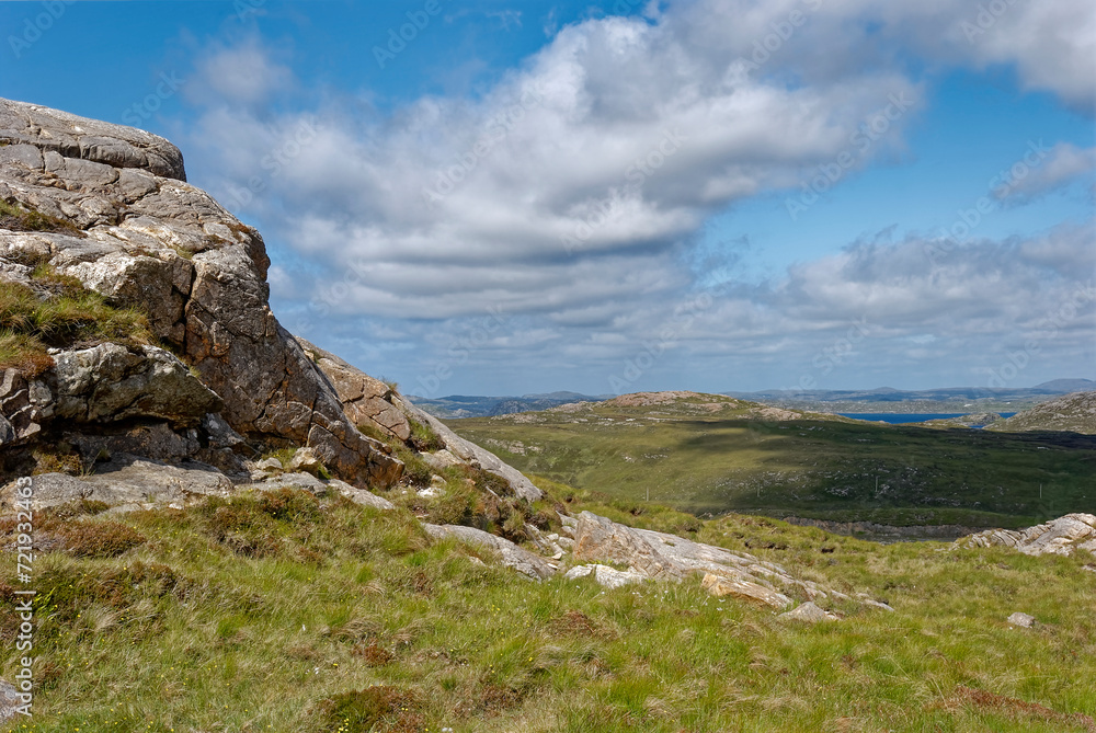The view across the interior of the Isle of Lewis in the Hebrides from a Granite Crag looking North towards the Sea.