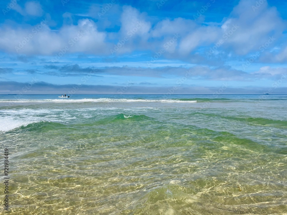 Transparent sea water, beautiful azure sea coast, sand beach, natural blue sea background