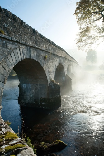 a stone bridge over a river