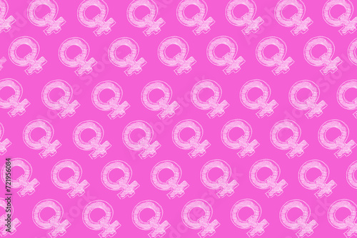Background from hand drawing women gender icons on pink background.