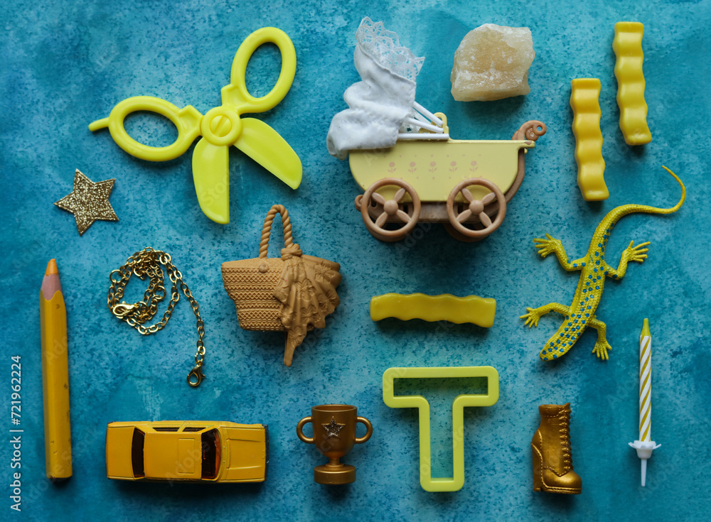 Fototapeta premium a blue background with a variety of yellow toys and items