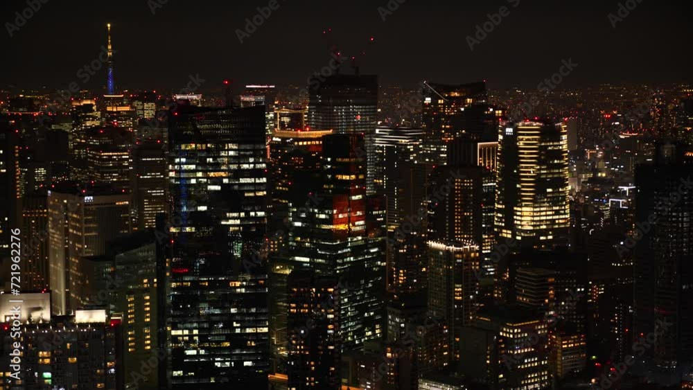 Aerial View of Japanese skycrapers from Roppongi, Tokyo, Japan at night. Scenery of central downtown area with Tokyo sky tree and business district. High quality 4k footage Aerial View of Japanese skycrapers from Roppongi, Tokyo, Japan at night. Scenery of central downtown area with Tokyo sky tree and business district. High quality 4k footage