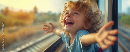 Happy child traveling by train photo