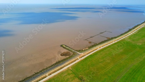 Wurster North Sea Coast - Wremen - Northern Germany - the dike and the dike foreland in the mudflats photo