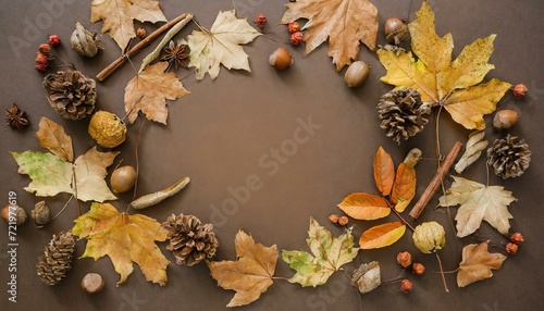 Autumn Elegance: Top View of a Frame Crafted from Dried Leaves on a Rich Brown Background"