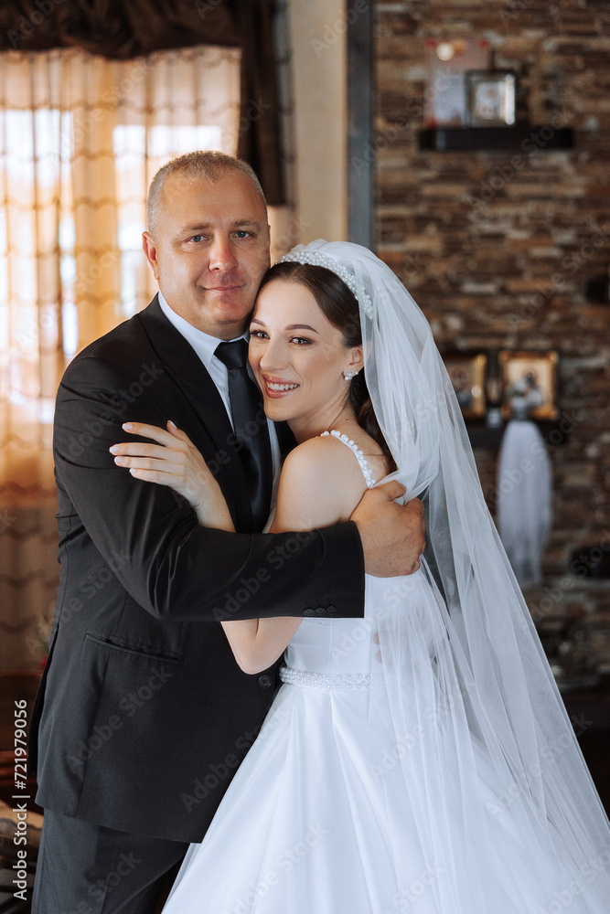 A beautiful bride with her father on her wedding day. The best moments of the wedding day. Daughter and father. A beautiful bride with her father on her wedding day. The best moments of the wedding day. Daughter and father.