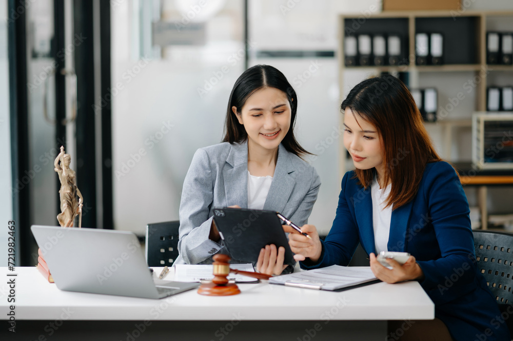 Asian business team and lawyers discussing contract papers. Concepts of law, advice, legal services. Asian business team and lawyers discussing contract papers. Concepts of law, advice, legal services.