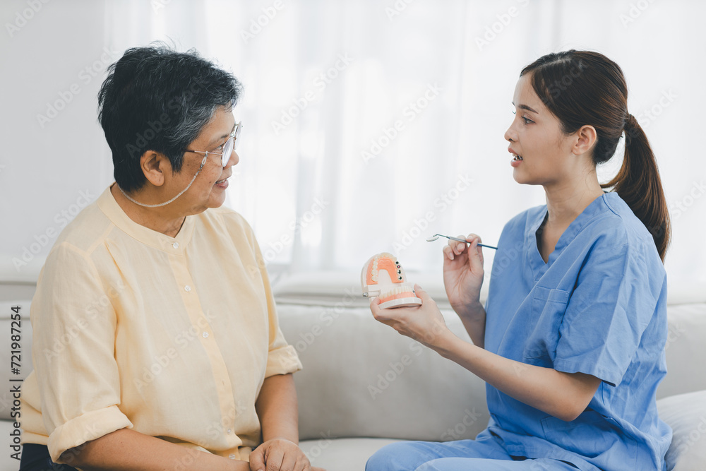 Woman dentist in dental office talking with Senior female patient and preparing for treatment. A dentist talking to Senior woman in dentist surgery, a dental check-up.