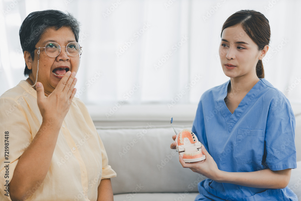 Woman dentist in dental office talking with Senior female patient and preparing for treatment. A dentist talking to Senior woman in dentist surgery, a dental check-up.