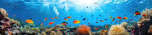 A vibrant underwater scene with a school of tropical fish swimming among colorful coral under the dappled sunlight of the ocean surface.