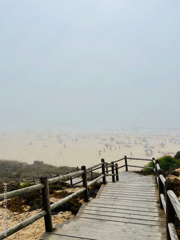 Foggy ocean coast, sea beach in the fog