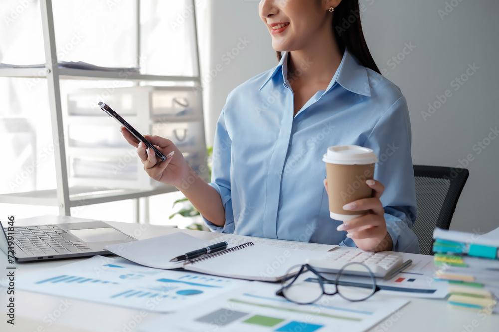 Shot of a young businesswoman using a laptop and having coffee in a modern office, Beautiful young smiling asian businesswoman working on laptop and drinking coffee, Shot of a young businesswoman using a laptop and having coffee in a modern office, Beautiful young smiling asian businesswoman working on laptop and drinking coffee,