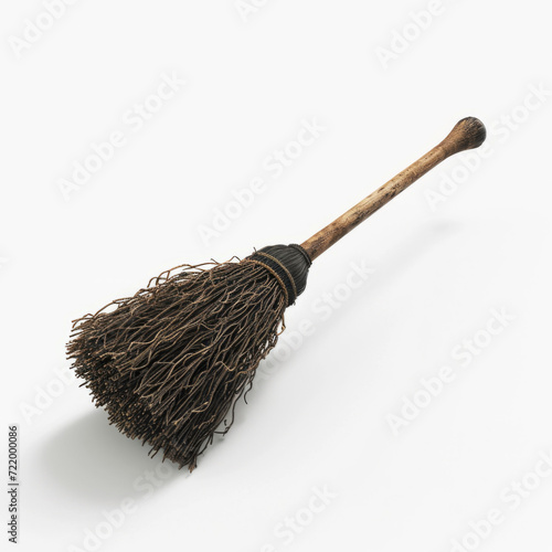 Old-fashioned witch's broomstick on an isolated white backdrop