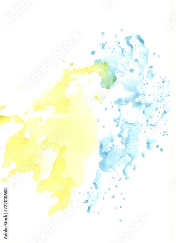 Yellow and blue watercolor paint stains on white papper 