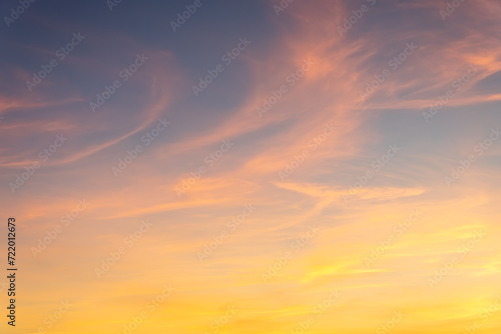 Blue-orange sunset on the cloudy sky. Nature texture.