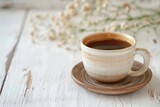 Cup of aromatic black coffee on a white rustic wooden background