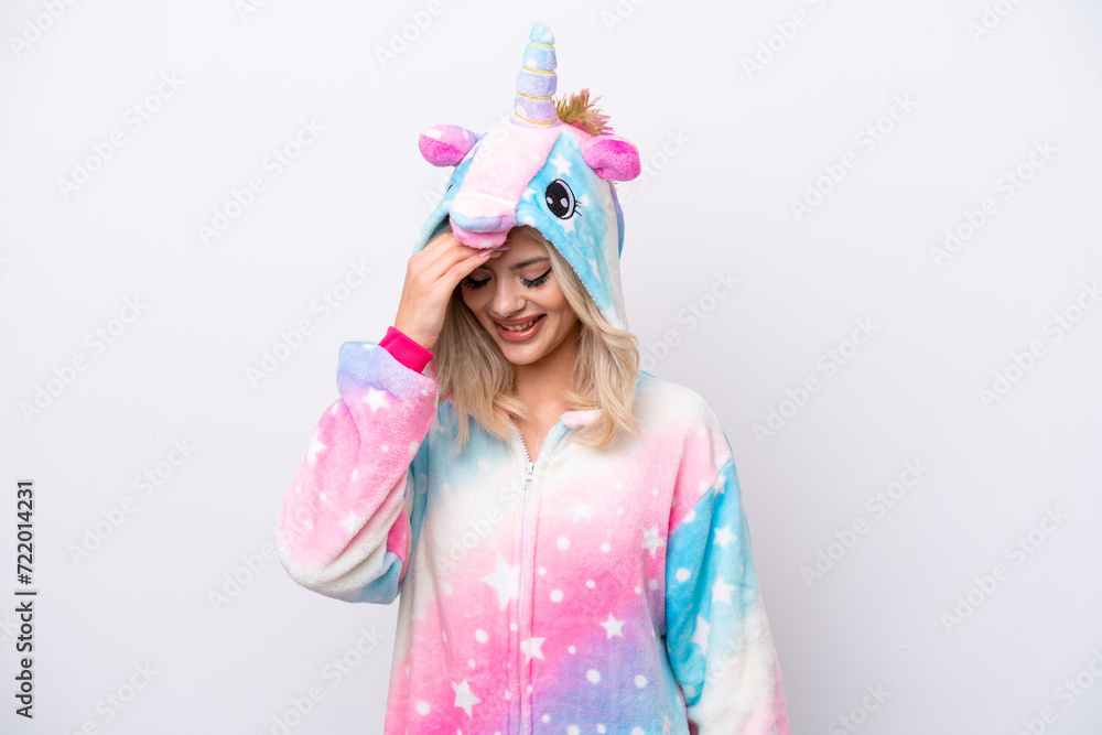 Young Russian woman with unicorn pajamas isolated on white background laughing Young Russian woman with unicorn pajamas isolated on white background laughing
