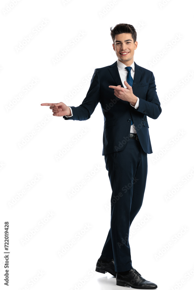 side view of happy elegant man pointing fingers to side and indicating side view of happy elegant man pointing fingers to side and indicating