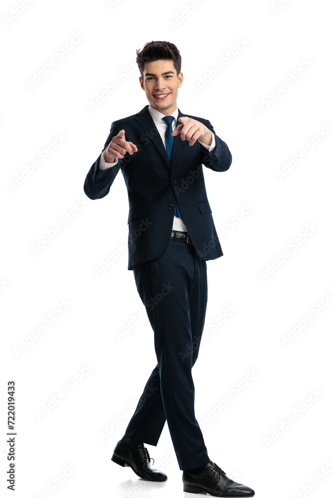 full body picture of happy elegant man pointing fingers forward full body picture of happy elegant man pointing fingers forward