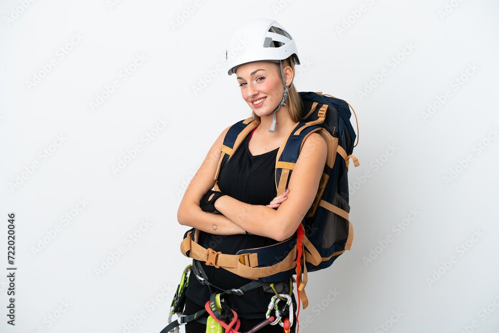 Young caucasian rock climber woman isolated on white background with arms crossed and looking forward