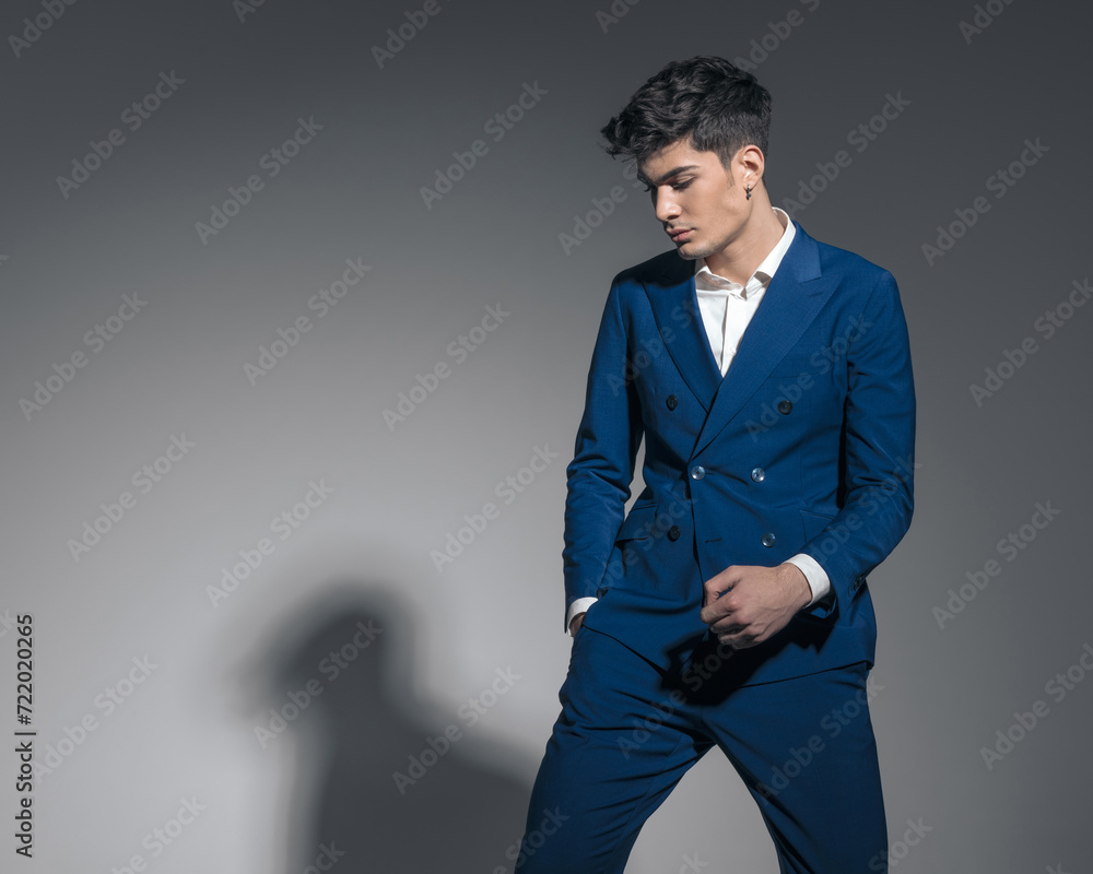 Obraz premium sexy fashion man looking down to side