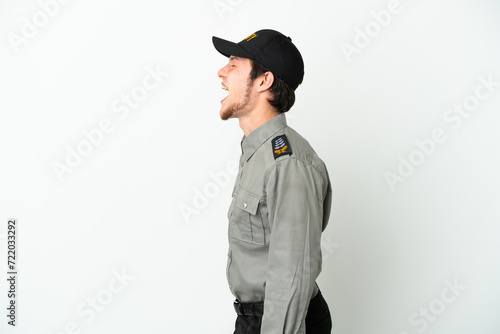 Young Russian security man isolated on white background laughing in lateral position