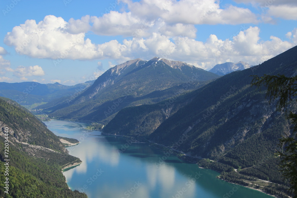 Achensee view to the mountains lake green with mirror sky Achensee view to the mountains lake green with mirror sky