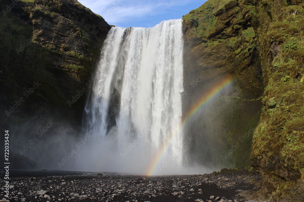 Fototapeta premium Iceland waterfall green grass and rainbow