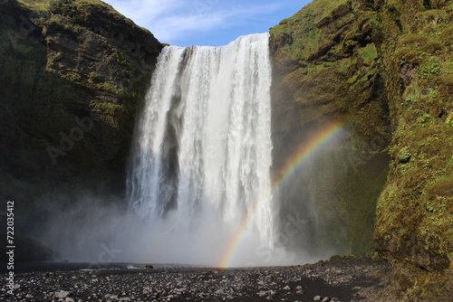 Fototapeta Naklejka Na Ścianę i Meble -  Iceland waterfall green grass and rainbow