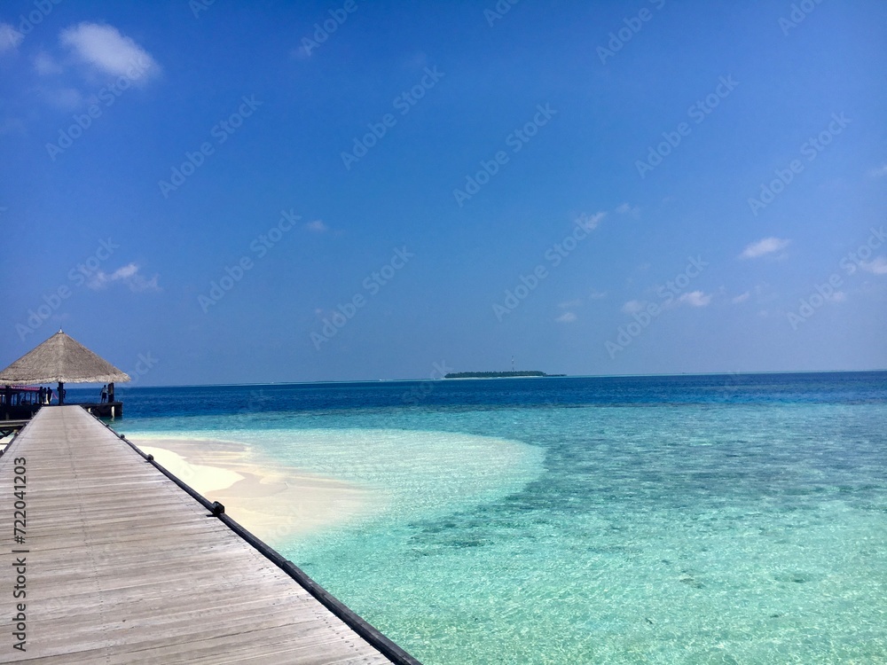 Maledives sea water and white beach and bridge