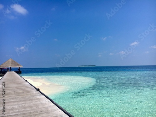 Maledives sea water and white beach and bridge