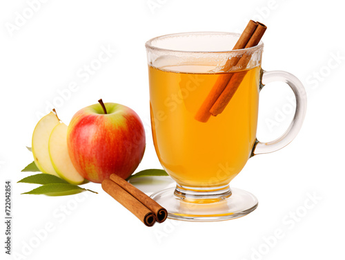 a glass mug of apple cider with cinnamon sticks and leaves