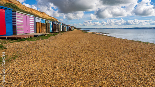 Beach Huts on the Channel Coast in Barton-on-sea, Hampshire, England, UK photo