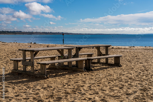 Picnic benches on the beach in Avon Beach, Mudeford, Dorset, England, UK © Bernd Brueggemann