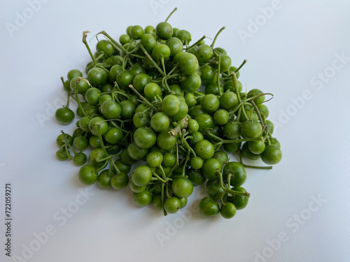 Fruit of Solanum nigrum, the European black nightshade or leunca, isolated on white background photo