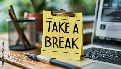 Work place,office room desk with sticky note text "Take a break" concept for relaxing,enjoy life.