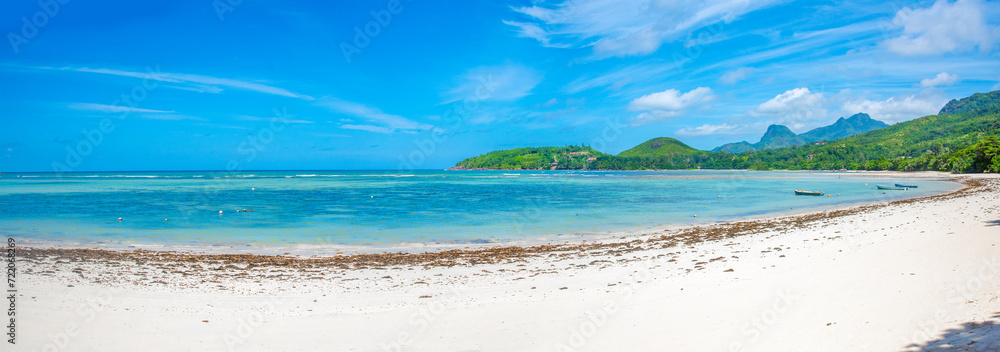 Panoramic view of a tropical beach on a sunny day