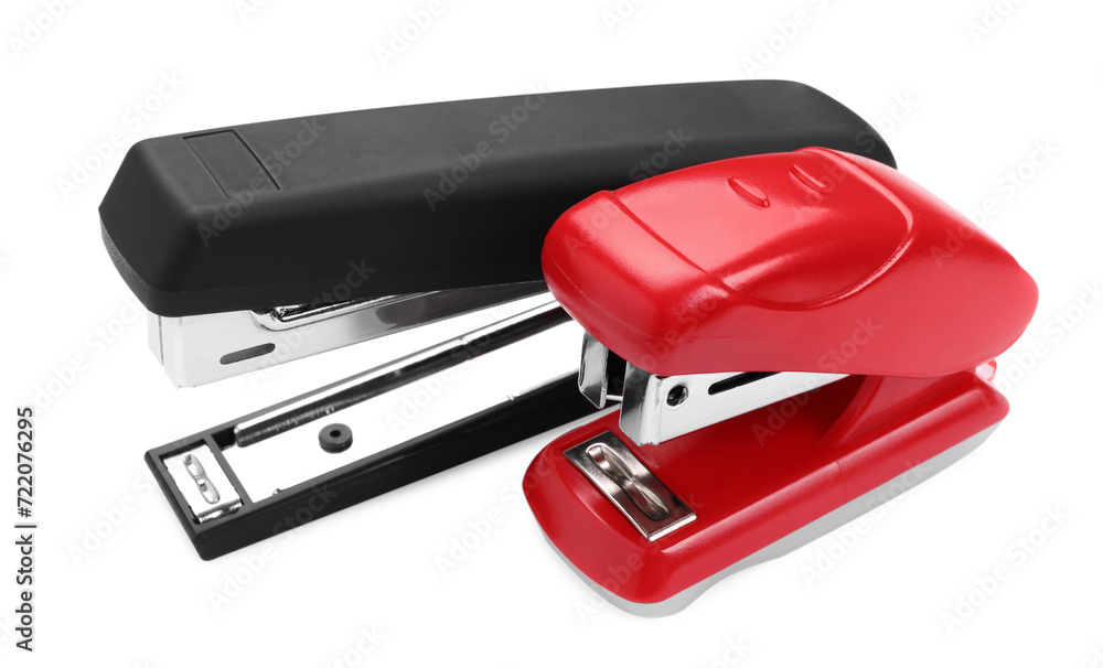 Two new bright staplers isolated on white, closeup Two new bright staplers isolated on white, closeup