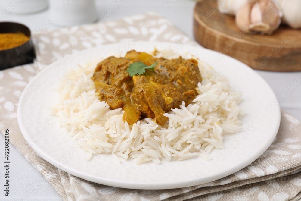 Delicious chicken curry with rice on table, closeup Delicious chicken curry with rice on table, closeup