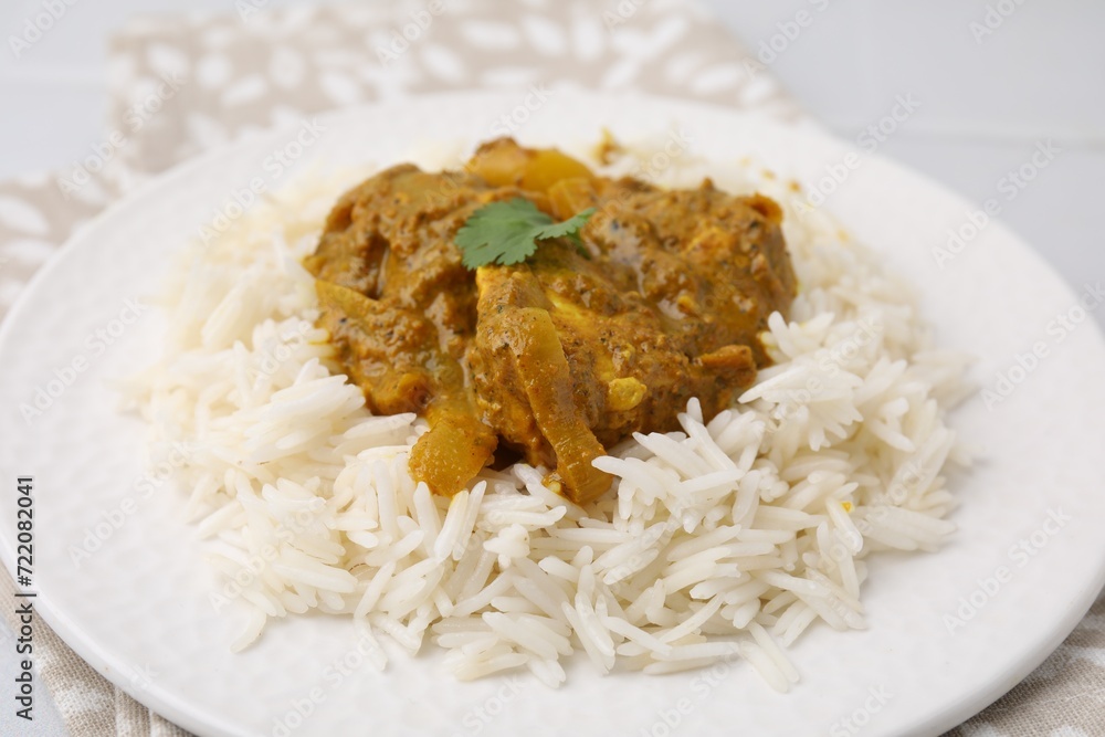 Delicious chicken curry with rice on table, closeup