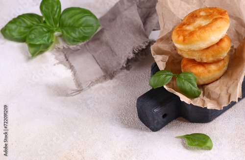 fried pies for snack on a wooden board photo