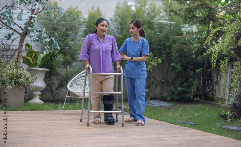 Caregiver Assisting Patient with Walking Exercise.