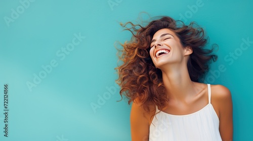 Realistic depiction of a happy, smiling woman having a delightful time, set against a colorful backdrop with ample copy space