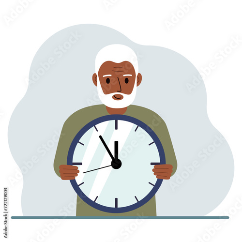 The man is holding a big clock in his hands. Time management, planning, organization of working time, effective business, deadline.