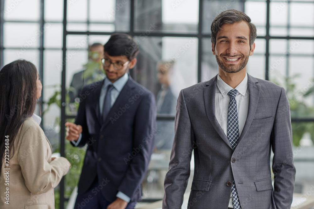 Portrait of casual caucasian male worker looking at camera Portrait of casual caucasian male worker looking at camera