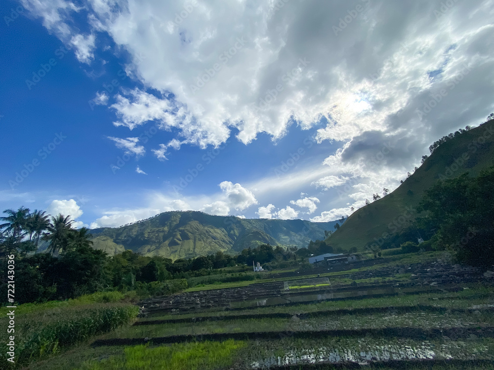 The fields and hills against blue sky at Lake Toba, Nort Sumatra. 