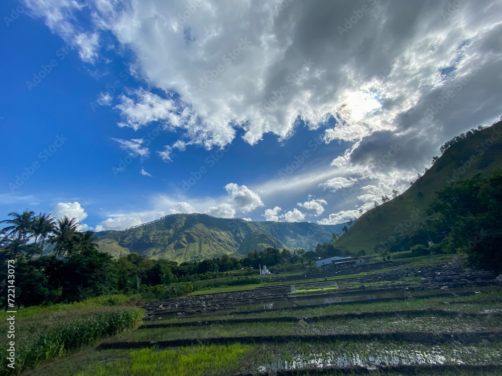 The fields and hills against blue sky at Lake Toba, Nort Sumatra. 