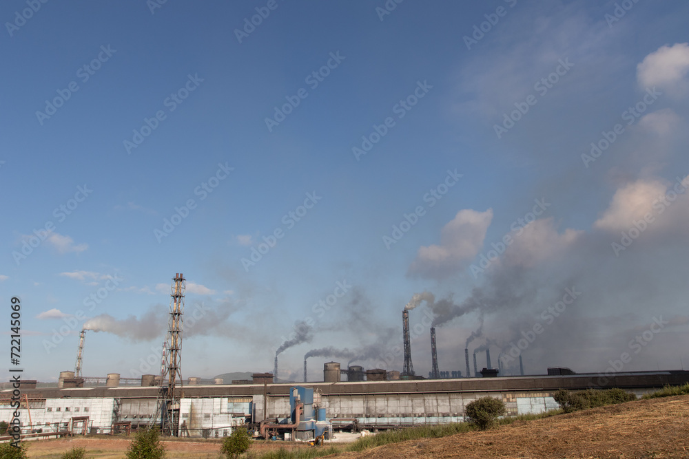 Industrial Air Pollution environmental disaster. Black Smoke from the factory pipes Industrial Air Pollution environmental disaster. Black Smoke from the factory pipes