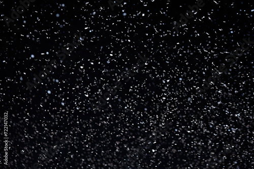 Snowfall on black background. Snowflakes on black background